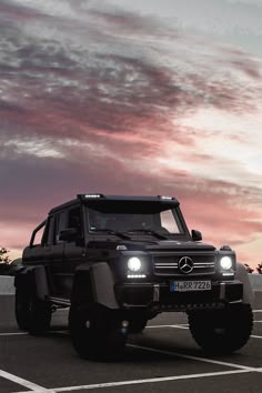 a mercedes benz truck parked in a parking lot