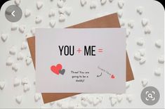 a card that says, you + me = thank you are going to be a daddy