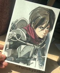 a person holding up a drawing of a character from the video game fire emblems