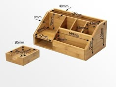 a wooden box with compartments and measurements