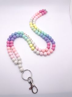 These gorgeous lanyards are made with 10mm beads. We use high quality bead wire which allows you to move throughout your day without worrying about the strength of your lanyard. Each lanyard is 34 inches long, includes a keyring and lobster claw, and can be personalized to include your name or any other saying. You can choose from four different bead colors for personalization and add on a tassel too! ⭐️if you prefer your lanyard to be short or longer send me a message and we can accommodate. ⭐️ Handmade Pink Beaded Lanyards, Multicolor Personalized Lanyards With Round Beads, Personalized Multicolor Lanyards With Round Beads, Pink Round Beads Necklace For Personal Use, White Lanyard With Colorful Beads As Gift, Gift Beaded Chain Lanyard, Multicolor Round Bead Jewelry For Personal Use, Colorful Round Beads Necklace, Diy Lanyard Beaded