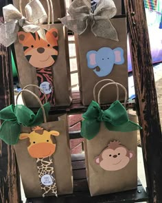 three brown bags with animals and giraffes on them, tied to each other