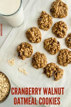 oatmeal cookies and a glass of milk on a white napkin next to it