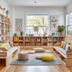 a living room filled with lots of furniture and bookshelves next to a window