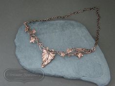 Antique copper leaf necklace Vines and leaves twist and twine to create this nature inspired antique copper necklace. Your neck piece will be made to order in the style shown. Due to the nature of the design no two pieces could ever be the same which makes each piece truly unique to you and also allows you to add a variation if you wish to do so. The focal piece will measure approximately 5 - 6 inches across and the chain length can be chosen by you. Please select your length from the drop down box. You can measure yourself with a flexible tape measure. Start at the centre of one collar bone, wrap the tape measure around your neck, finishing at the centre of your other collar bone.  If you would like advice on the length you will require, please ask.  **When choosing your chain length, ple Nature-inspired Rose Gold Necklace, Hand Forged Copper Necklace In Rose Gold, Hand Forged Rose Gold Copper Necklace, Bronze Nature-inspired Pendant Necklace, Handmade Bronze Leaf Jewelry, Handmade Rose Gold Nature-inspired Necklaces, Nature-inspired Copper Wire Necklace As Gift, Nature-inspired Copper Wire Necklace For Gifting, Soldered Copper Rose Gold Necklace