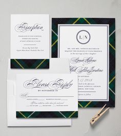 the wedding stationery is laid out on top of each other