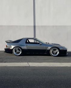 a black sports car parked on the street