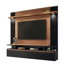 an entertainment center with a flat screen tv mounted on the wall