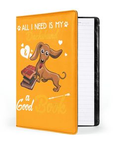 an orange notebook with a dog on it and the words all i need is my dachshund