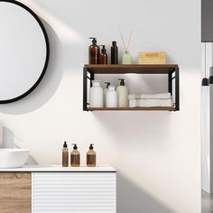 a bathroom with a sink, mirror and shelving unit in the middle of it