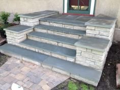 a set of stone steps leading up to a door