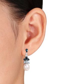 These delightful dangle earrings from Belk & Co. feature 8.5 - 9 mm freshwater white, rice Pearls with pear-cut 2.5 ct. t.w. London-blue Topaz and marquise-cut Sky Blue Topaz and round-cut White Topaz stones. This classic pair is set in Sterling Silver and are secured with post backs. | Belk & Co Women's Pearl and 2.5 ct. t.w. Blue and White Topaz Cluster Drop Earrings in Sterling Silver Blue Earrings Wedding, Ear Pins Earrings, Blue Wedding Jewelry, Freshwater Pearl Drop Earrings, Topaz Color, Freshwater Pearls Earrings, Sky Blue Topaz, Topaz Stone, White Rice