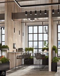 an office with lots of windows and plants on the desks in front of them