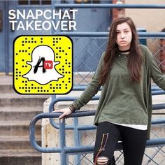 a woman standing next to a blue fence with the words snapchat takeover on it