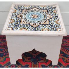 a white table with colorful designs on it