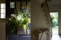 a vase filled with flowers sitting on top of a wooden shelf next to a door