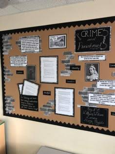 a bulletin board with some writing on it and pictures pinned to the wall behind it