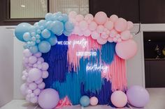 balloons and streamers are on display in front of a sign that reads, we can party like it's birthday