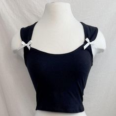 **Brand New*** Alanis Coquette Bow Top | Slip Into Playful Elegance With Our Alanis Coquette Bow Top! The Cropped Sleeveless Design Features Charming Ribbon Detailing On The Side, Adding A Touch Of Coquettish Flair. Perfect For A Night Out Or A Fun Day With Friends. Brand: Black + Moon Available In Sizes S & L Sleeveless Ribbon Bow Details Cropped Stretchy Imported 97% Cotton, 3% Polyester True To Size Black Crop Top With Straps For Summer, Black Strap Crop Top For Summer, Cute Black Crop Top For Summer, Cute Black Summer Crop Top, Moon Top, Coquette Fashion, Day With Friends, Scream 6