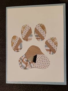 an animal's paw is shown in the middle of a card with polka dots on it