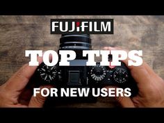 a person holding a camera with the words top tips for new users