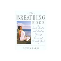 the breathing book with an image of a woman in white sitting on a rock by the ocean