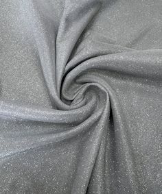 a silver fabric with glitter on it