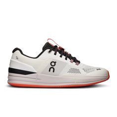 the on cloud running shoe in white and black with an orange stripe around the toe