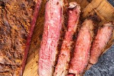 some meat is sitting on a cutting board