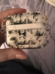 a person holding a cell phone case with pictures on it's side and in front of them