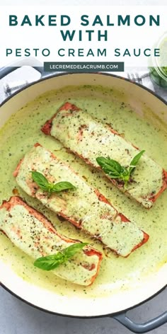 baked salmon with pesto cream sauce in a pan