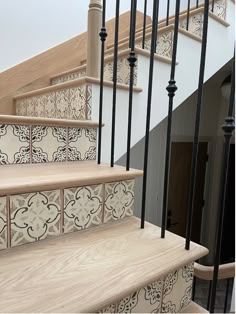 a stair case with decorative tiles on it