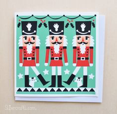 two nutcrackers are standing in front of a green background with white stars