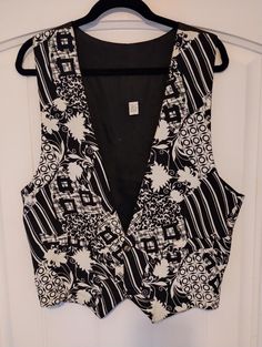 "This is a fabulous Vintage Mod 100% Rayon Abstract Design Vest Sz L. Made in the USA this beautiful jazzy vest features a 2 button closure. It has been gently worn and is in excellent condition. Measurement Length 23\" Chest 42\"" Retro V-neck Vest For Spring, Retro Fitted Summer Vest, Retro V-neck Spring Vest, Retro Fitted Vest For Summer, Spring V-neck Retro Vest, Vintage V-neck Vest For Spring, Retro V-neck Fitted Vest, Vintage Workwear Vest Top, Vintage Vest Top For Work