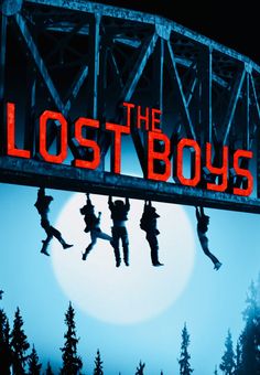 the lost boys movie poster with silhouettes jumping from bridge over water and full moon in background