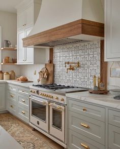 a kitchen with an oven, stove and counter tops in it's center island