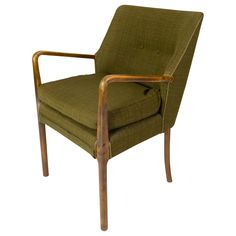 a green chair sitting on top of a wooden frame