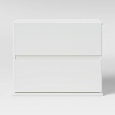 a white cabinet with two drawers on one side