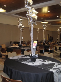 a black table cloth with silver decorations on it