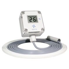 an electronic thermometer is connected to a white cord and plugged into a wall