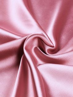 Indulge in the luxurious feel of this 58"/60" wide (147/152 cm) Silk Skin Duchess fabric, also known as Peau de Soie. Its dull satin finish and lightweight drape make it a perfect choice for creating elegant bridesmaid dresses, formal gowns, or any special occasion attire. With a subtle sheen and smooth texture, this high-quality silk fabric offers a sophisticated look and feel. Whether you're a professional dressmaker or an avid sewing enthusiast, this versatile material will elevate your projects with its timeless beauty and exceptional craftsmanship. Elevate your sewing experience and create stunning garments that will turn heads with this premium Silk Skin Duchess fabric. Luxurious Fabric: Crafted from exquisite peau de soie silk, this fabric offers a dull satin finish and a smooth, su Dusty Rose Satin Dress, Silk Fabric Texture, Duchess Fabric, Bridesmaid Dresses Formal, Types Of Fabric, Elegant Bridesmaid Dresses, Stunning Prom Dresses, Satin Roses, Elegant Drapes