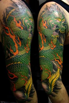 a man with a dragon tattoo on his arm and leg is shown from the waist up