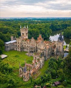 an old abandoned castle in the middle of trees