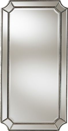 a large mirror with beaded trim around the edges