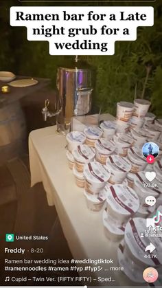 a table topped with lots of cups filled with food