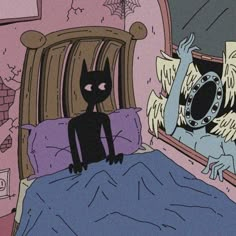 a black cat sitting on top of a bed next to a mirror