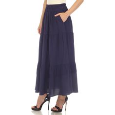 Elevate your fashion game with this flowy and effortlessly chic skirt. This maxi skirt from White Mark boasts a pleated design that adds texture, movement, and a touch of sophistication to your look. Dress it up or down as this skirt is incredibly versatile. Pair it with a tucked in blouse and heels for a sophisticated look or go for a more relaxed vibe with a tucked in tee and sandals and pair it with a jacket on chilly days. It’s perfect for various occasions and style preferences. Flowy Long Pleated Skirt, Solid Color Tiered Maxi Skirt For Day Out, Flowy Tiered Maxi Dress With Gathered Skirt, Summer Tiered Maxi Skirt With Pleated Waist, Long Flowy Skirt With Pleated Hem, Chic Tiered Maxi Skirt With Elastic Waistband, Flowy Wide Leg Maxi Skirt For Day Out, Chic Flowy Pleated Skirt With Elastic Waistband, Flowy Ruffled Flared Maxi Skirt