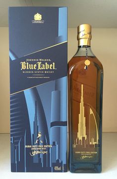 a bottle of blue label whiskey sitting next to a box