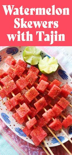 watermelon skewers on a plate with limes