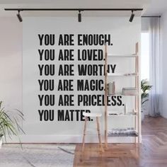 a black and white wall mural with the words you are enough, you are loved, you are worthy, you are magic, you are priceless, you matter